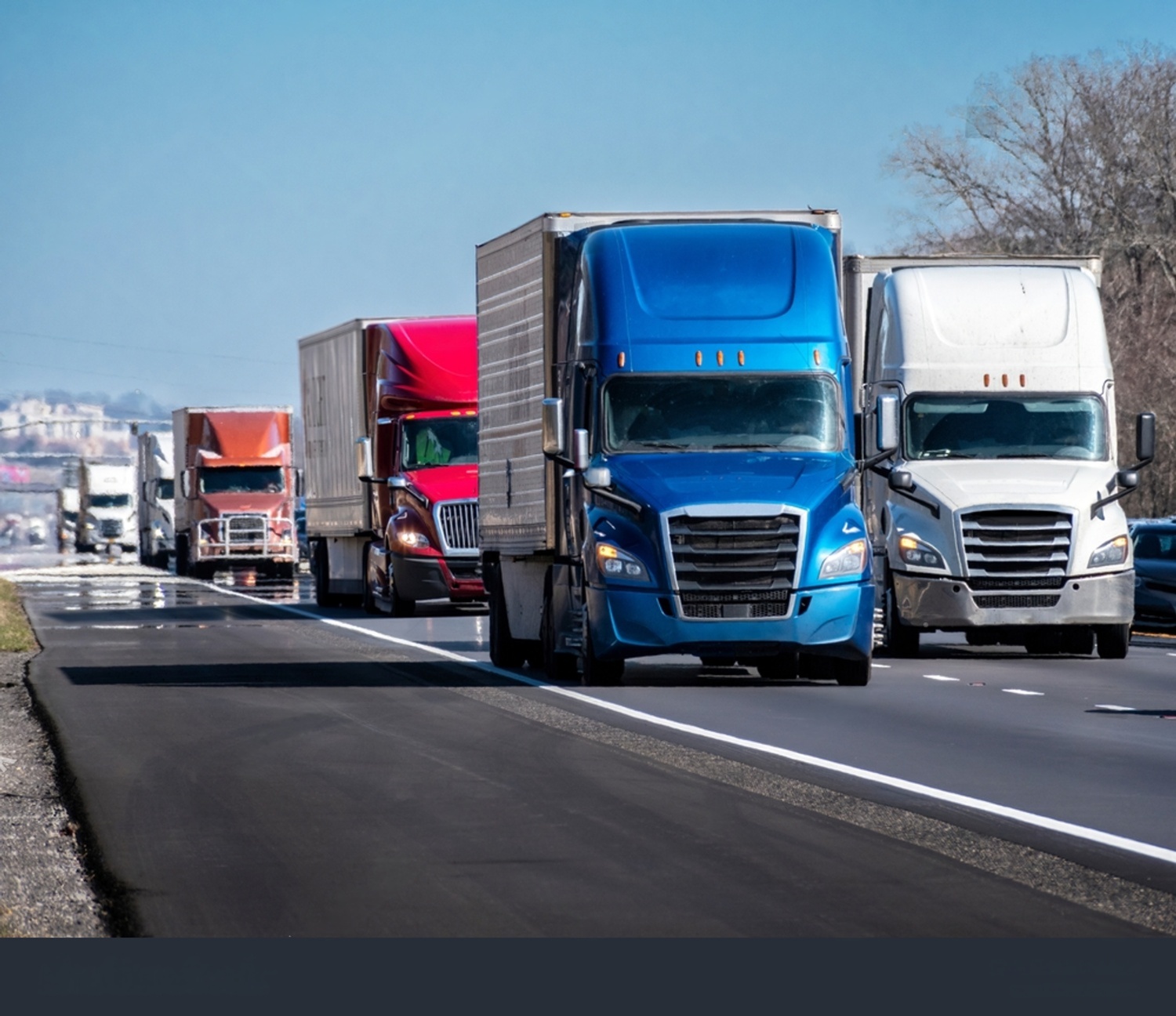 Fleet of 18-wheeler semi trucks on the highway